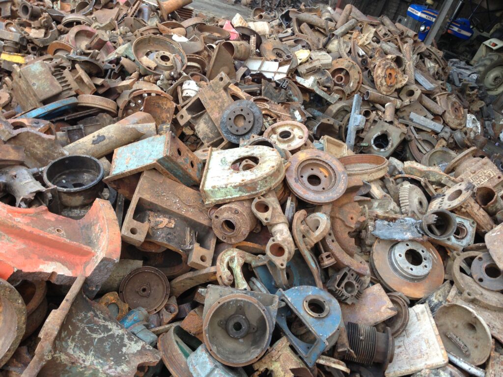 Rusty metal parts and industrial scrap collected at a local scrap yard near me by AS Traders, a trusted scrap shop near me for metal recycling.
